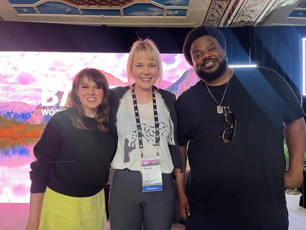 Sandy Hoekstra at Banff World Media Festival. One student and two actors, including Craig Robinson, engage in conversation and networking, showcasing their enthusiasm for media industry connections.