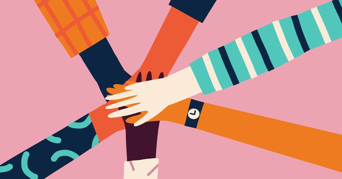 A group of people holding hands together on a pink background.