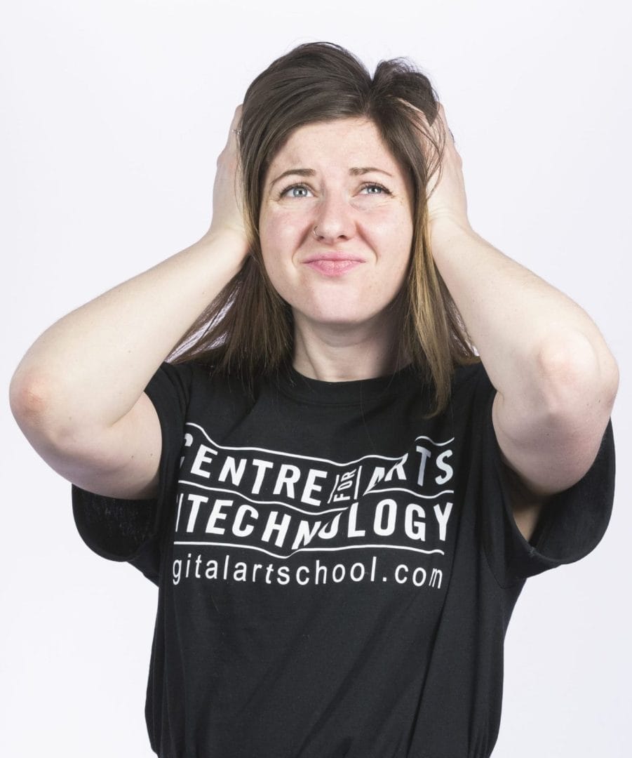 A girl with her hands on her head wearing a t - shirt that says centre for digital technology.